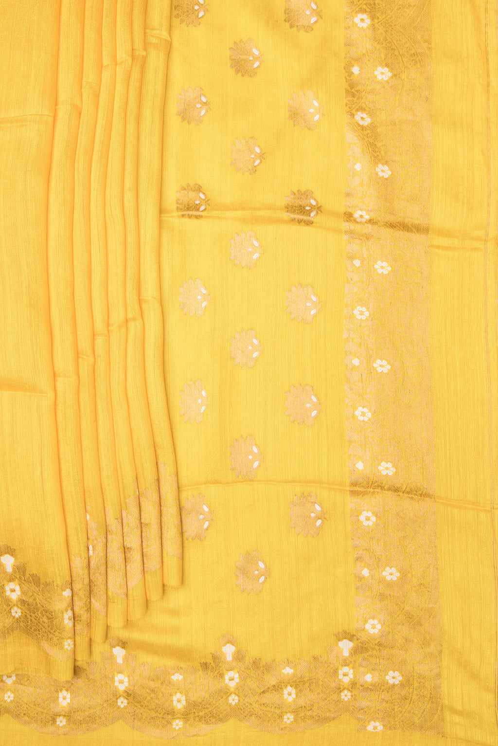 Pleats and pallu of Pure Silk Lemon Yellow Tussar Saree with Zari Butta on the body and Fancy Border. 