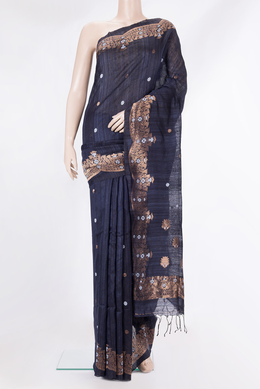 Navy Blue Tussar Saree with Zari Butta on the body and Fancy Border.  displayed on a mannequin