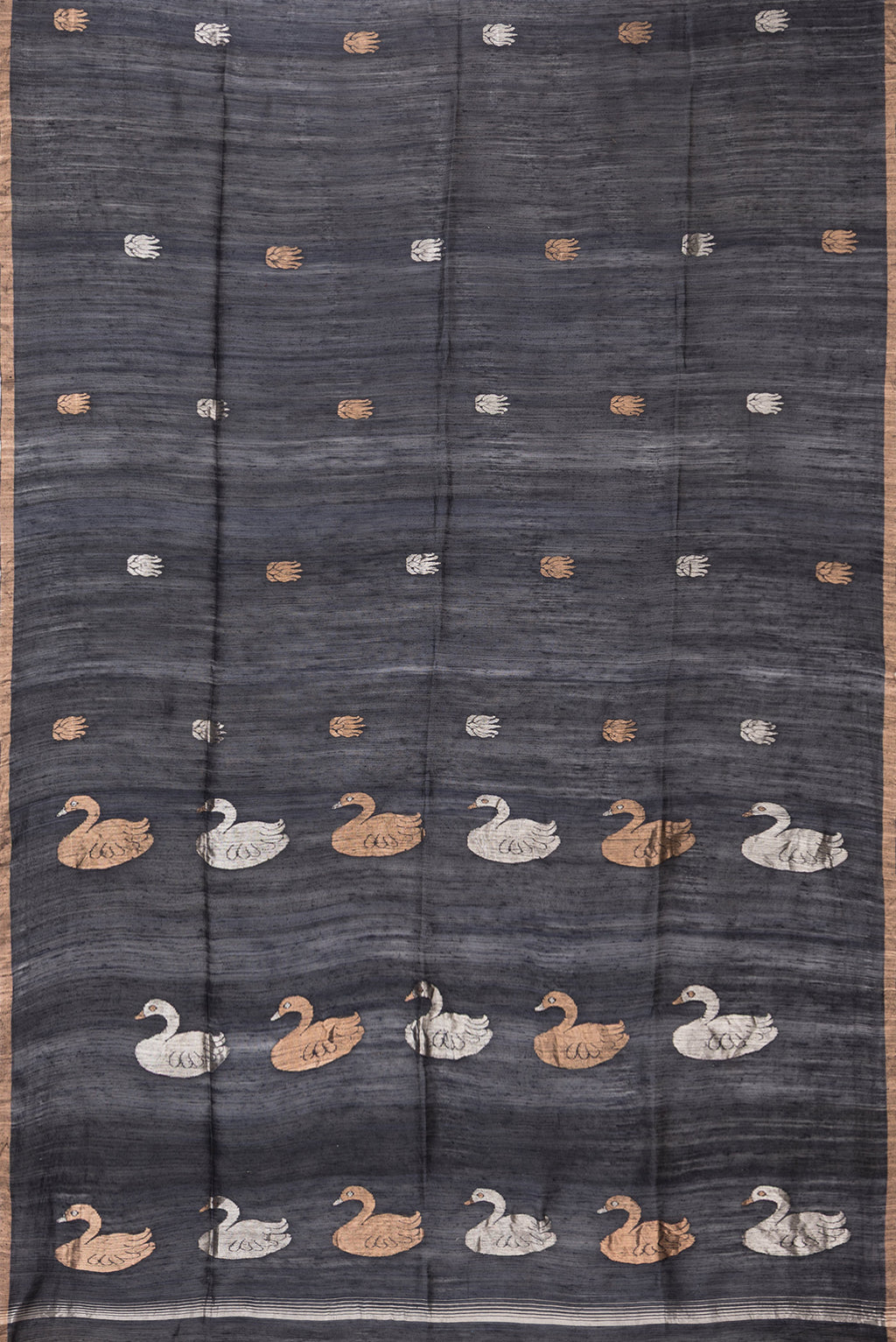 Flat view of Black Tussar Saree with Zari Butta on the body and Zari Border. 