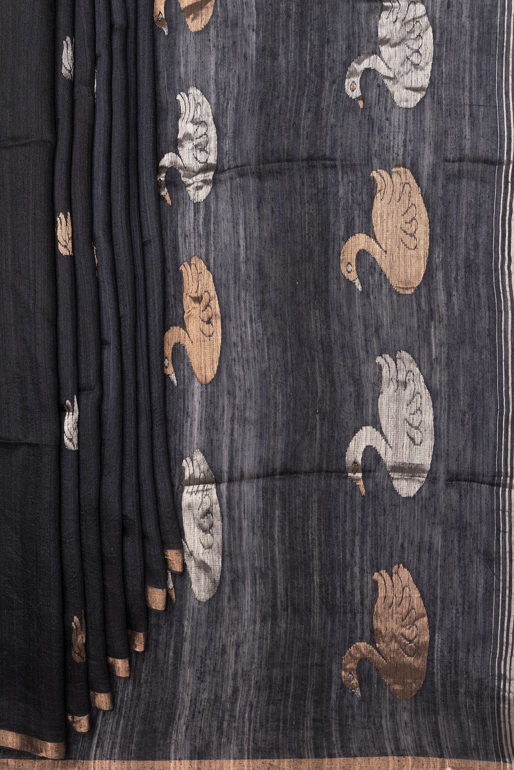 Pleats and pallu of Black Tussar Saree with Zari Butta on the body and Zari Border. 