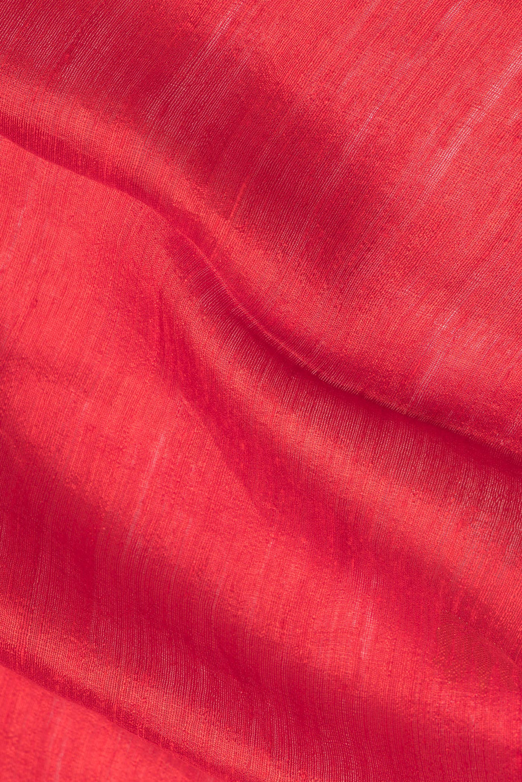 Close up of Red Tussar Saree with Zari Butta on the body and Zari Border.  displaying folds