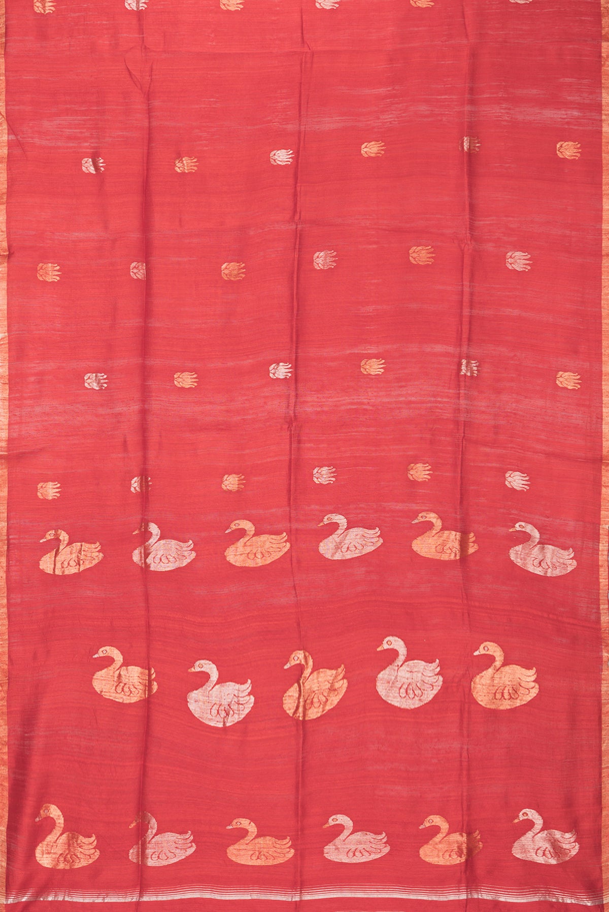 Flat view of Red Tussar Saree with Zari Butta on the body and Zari Border. 
