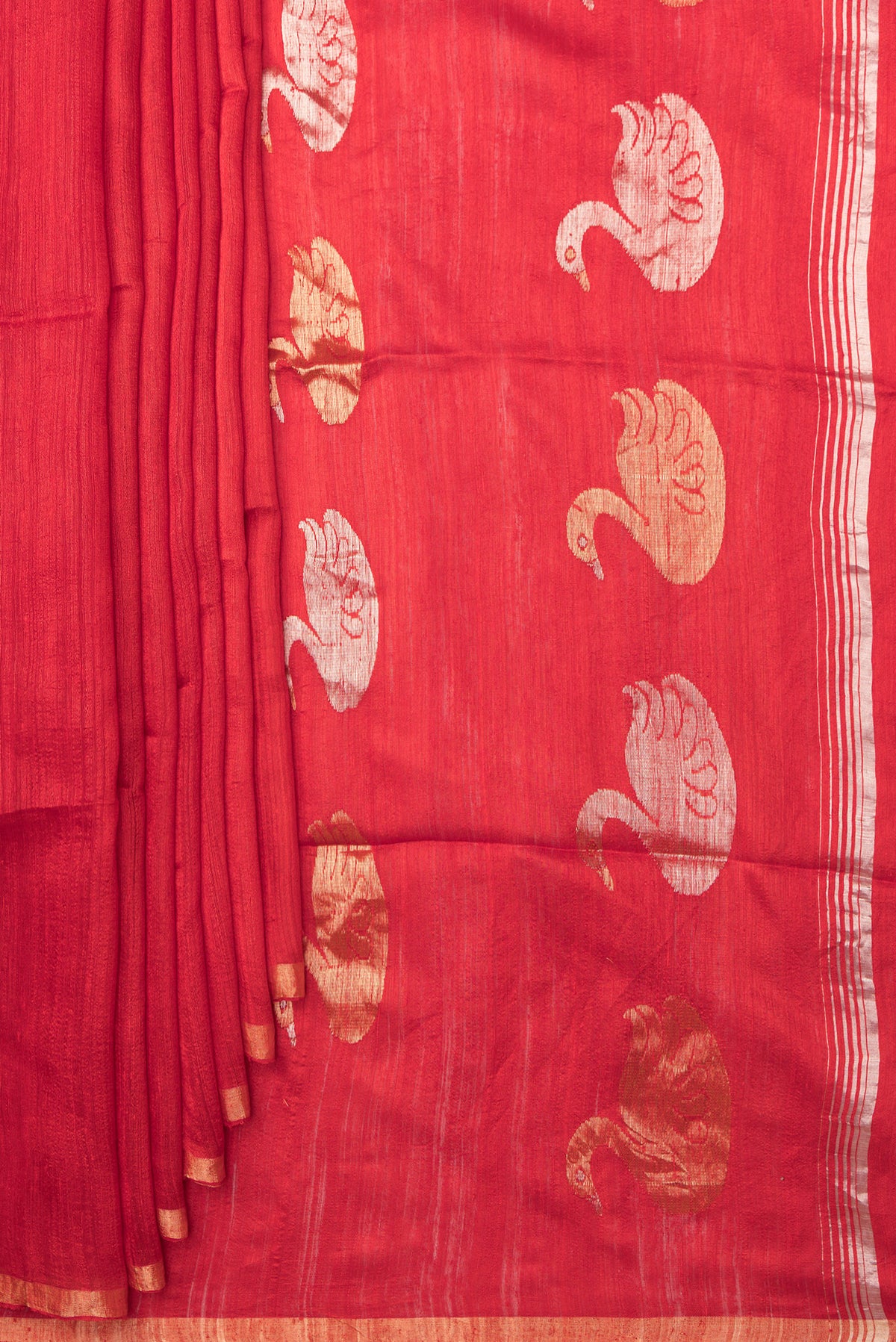 Pleats and pallu of Red Tussar Saree with Zari Butta on the body and Zari Border. 