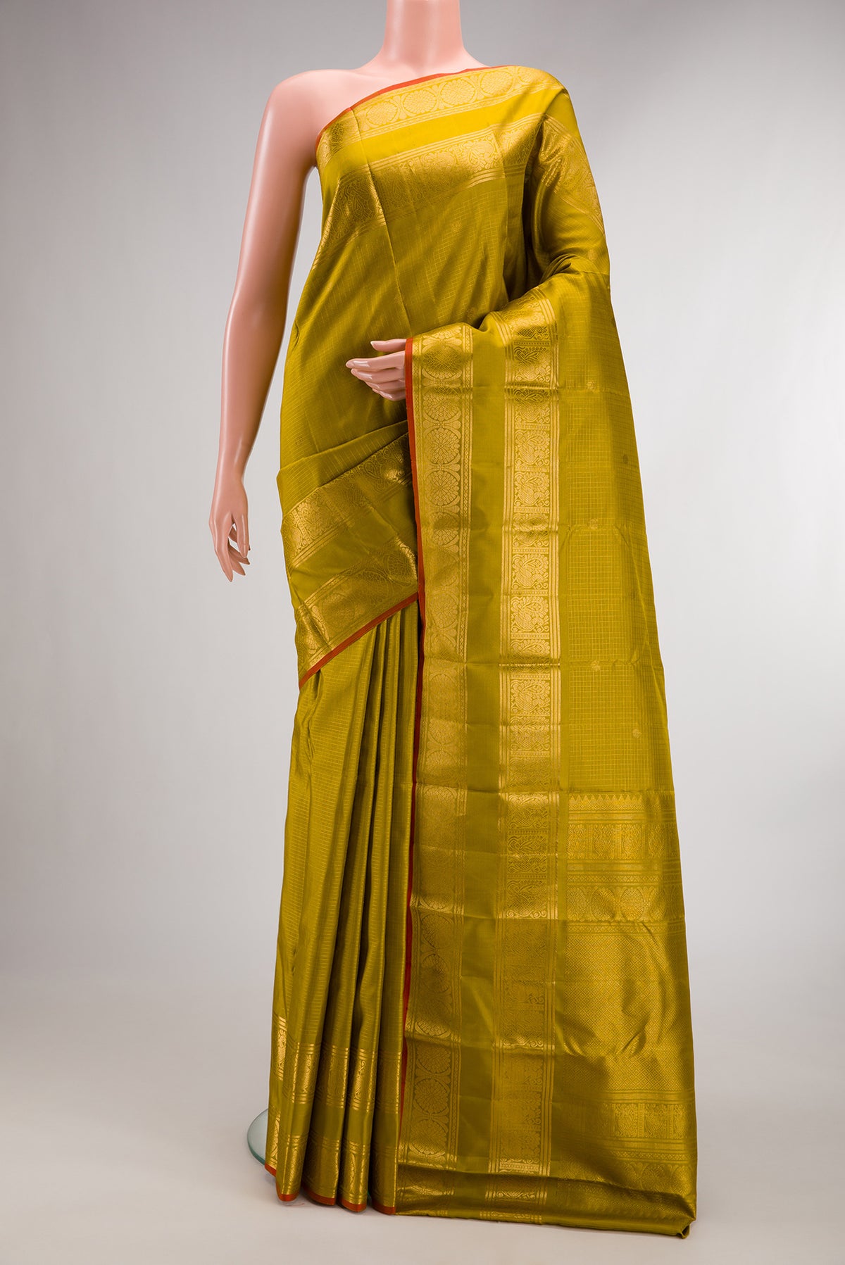 Pure Silk Mehandi Green Dual Tone Kanjivaram Saree with Checked design on the body and Zari Border.  displayed on a mannequin