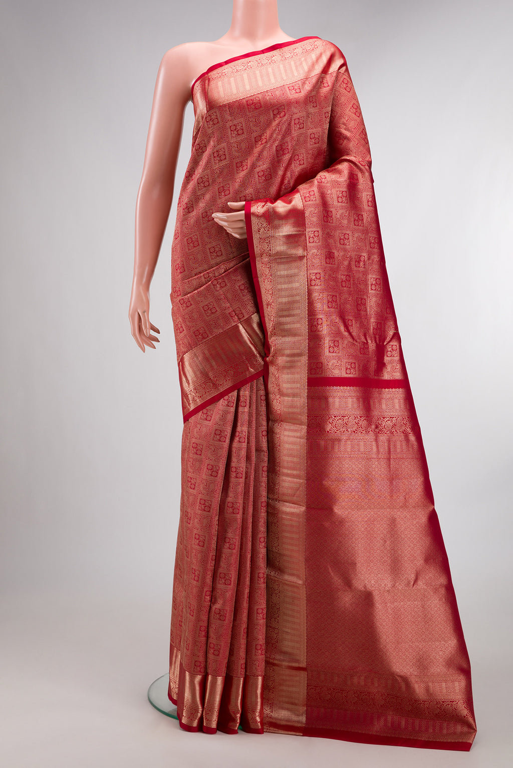 Pure Silk Red Kanchipuram Saree with Zari Brocade on the body and Zari Border.  displayed on a mannequin