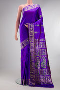 Pure Silk Purple Dual Tone Baluchari Saree with Zari And Thread Butta on the body and Fancy Border.  displayed on a mannequin
