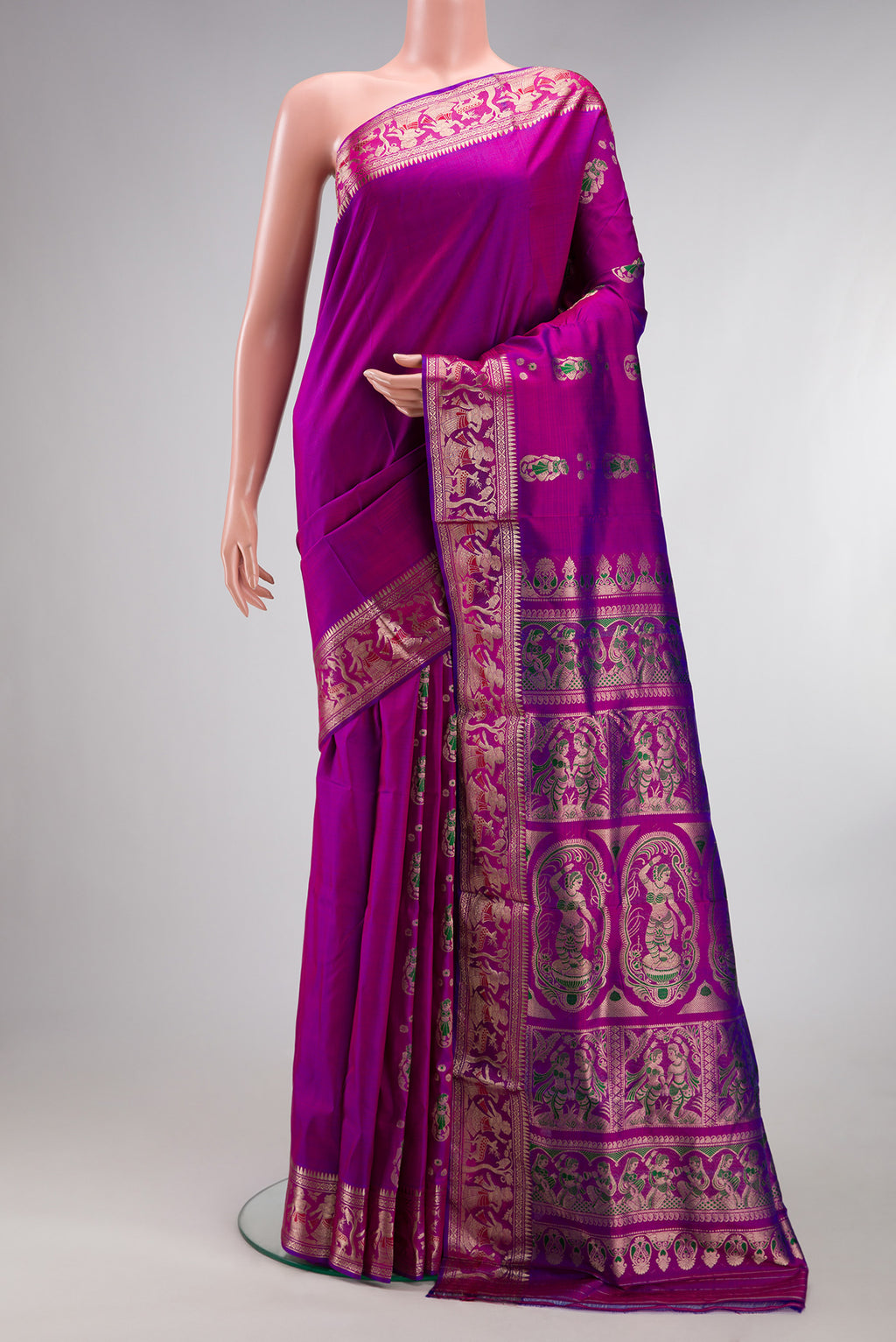 Pure Silk Magenta Dual Tone Baluchari Saree with Zari And Thread Butta on the body and Fancy Border.  displayed on a mannequin