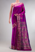 Pure Silk Magenta Dual Tone Baluchari Saree with Zari And Thread Butta on the body and Fancy Border.  displayed on a mannequin