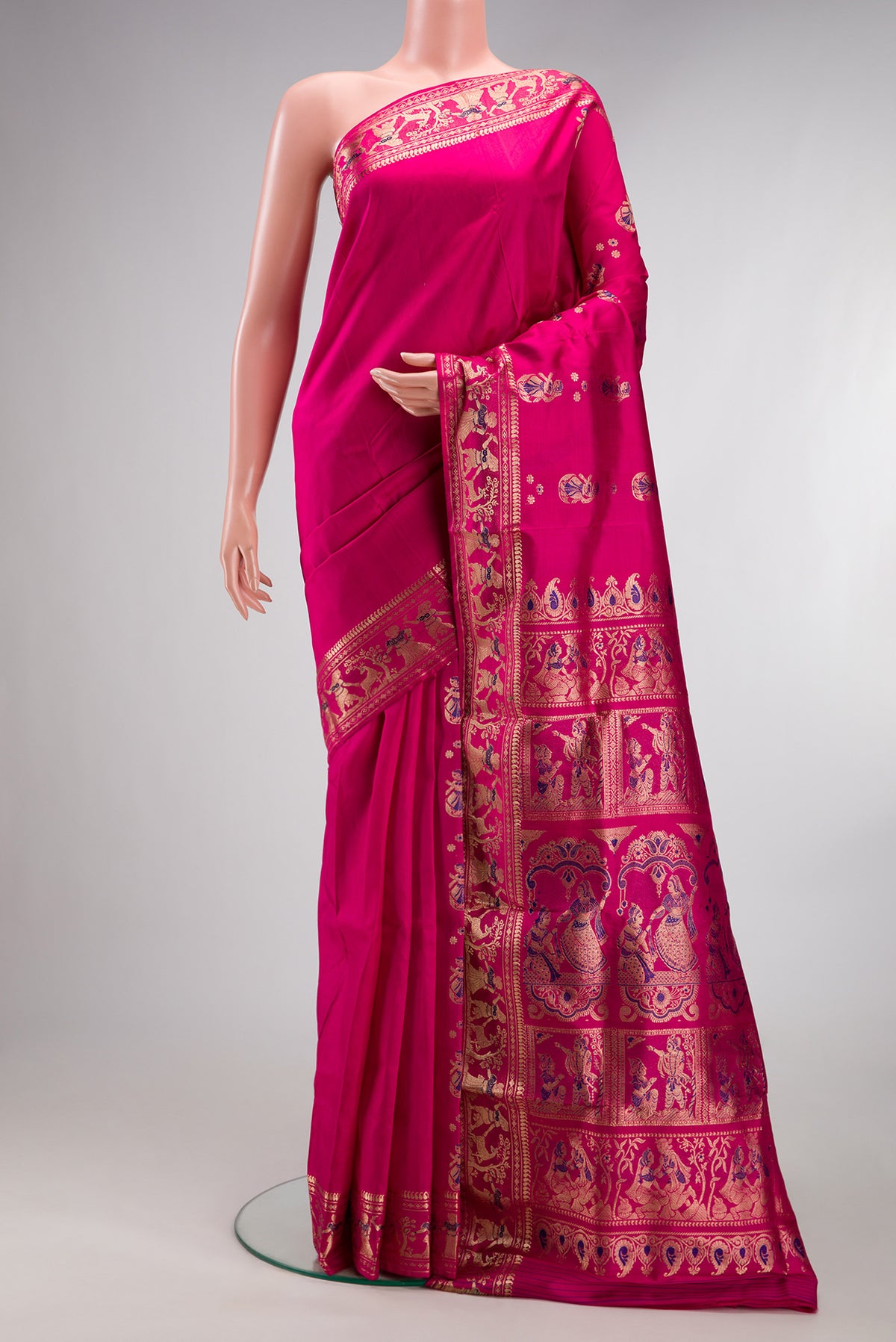 Pure Silk Dark Pink Dual Tone Baluchari Saree with Zari And Thread Butta on the body and Fancy Border.  displayed on a mannequin