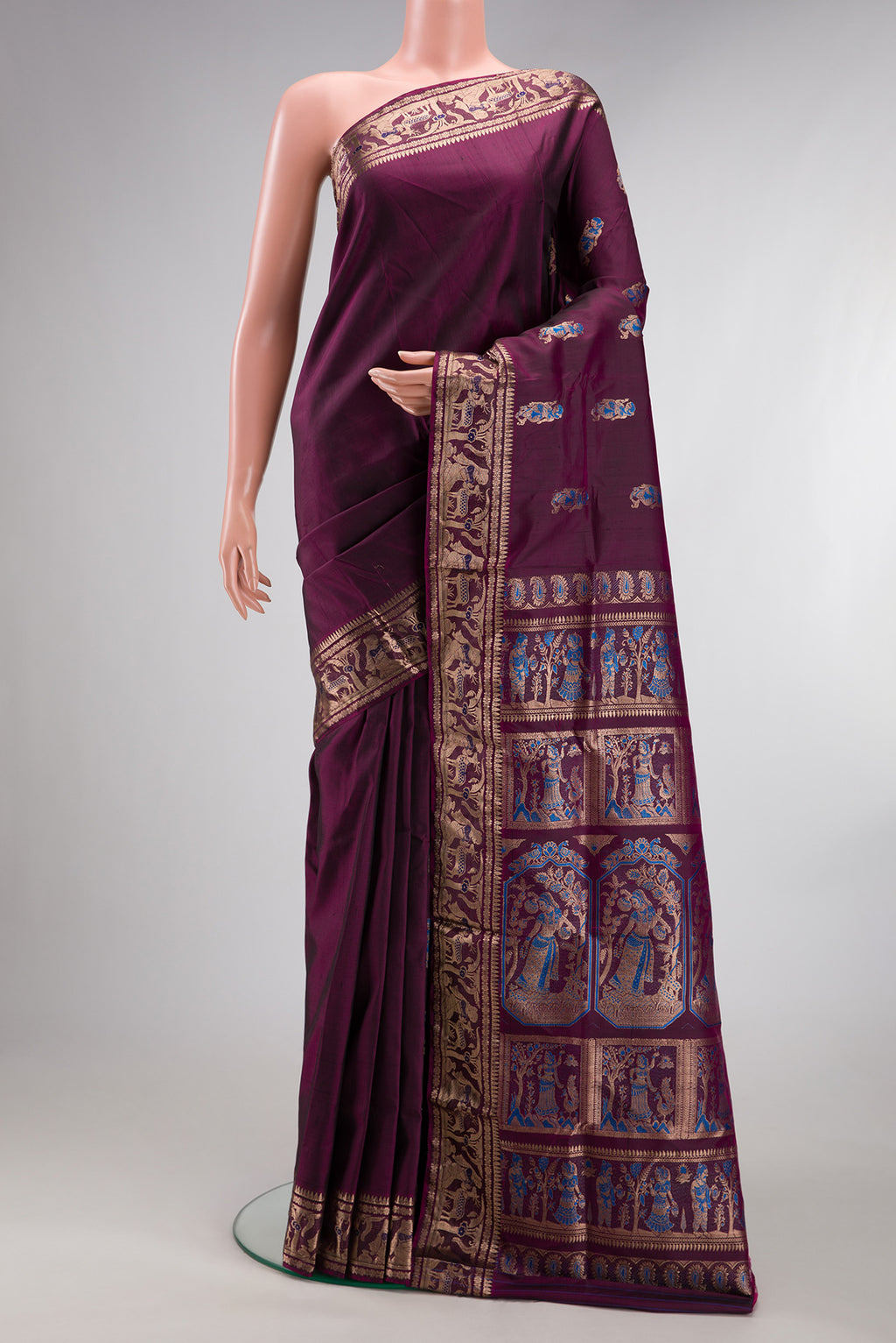 Pure Silk Burgundy Dual Tone Baluchari Saree with Zari And Thread Butta on the body and Fancy Border.  displayed on a mannequin