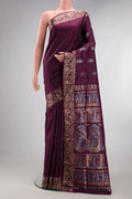 Pure Silk Burgundy Dual Tone Baluchari Saree with Zari And Thread Butta on the body and Fancy Border.  displayed on a mannequin