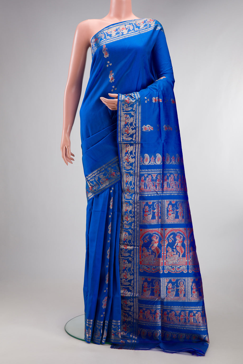 Pure Silk Royal Blue Baluchari Saree with Zari And Thread Butta on the body and Zari Border.  displayed on a mannequin