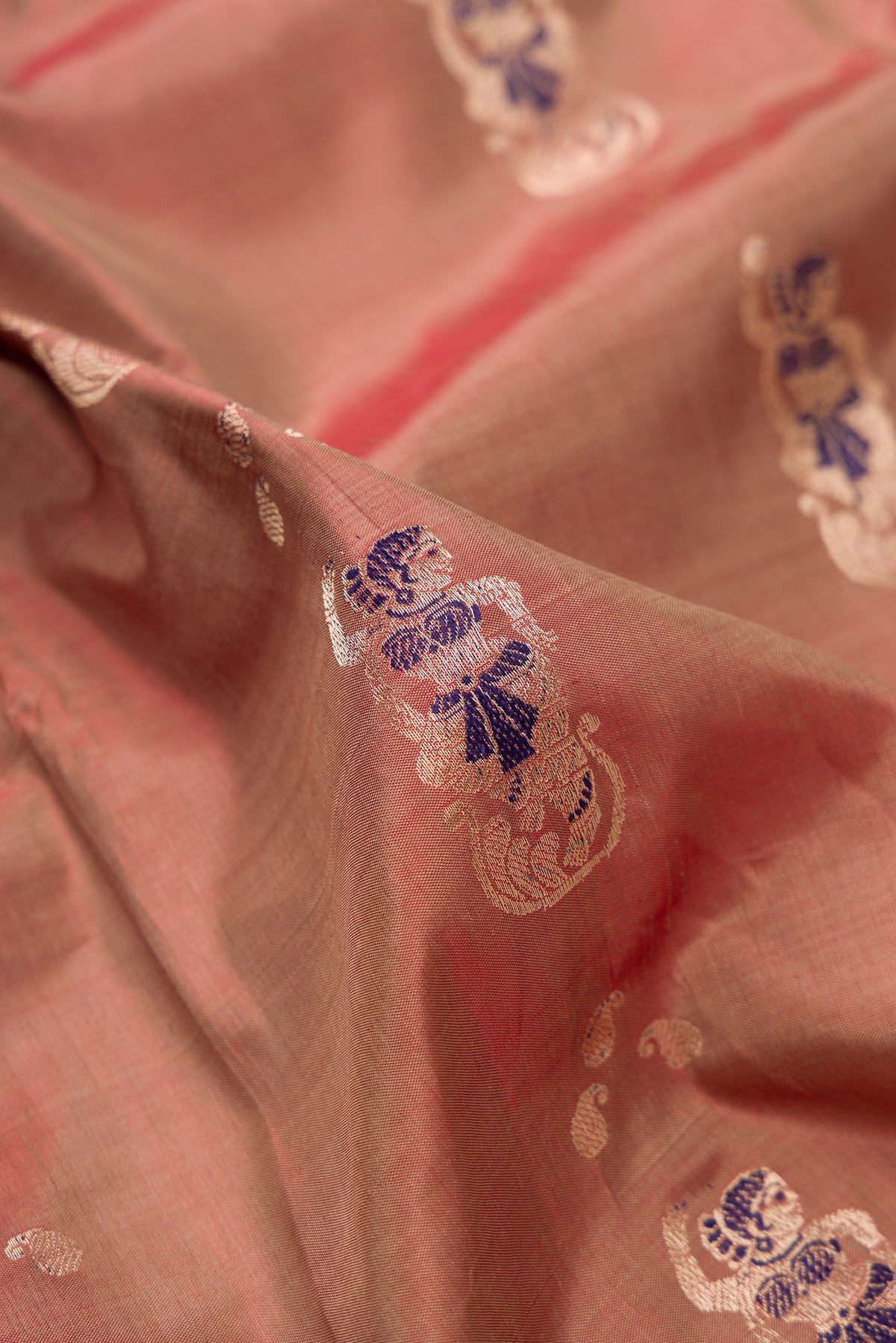 Close up of Pure Silk Brown Dual Tone Baluchari Saree with Zari And Thread Butta on the body and Fancy Border.  displaying folds