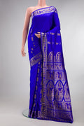 Pure Silk Royal Blue Baluchari Saree with Zari And Thread Butta on the body and Fancy Border.  displayed on a mannequin