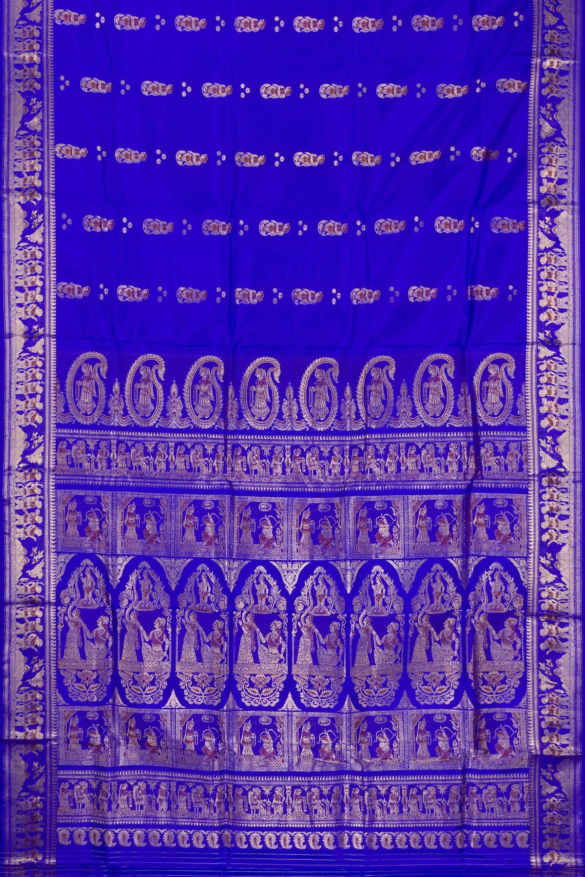 Flat view of Pure Silk Royal Blue Baluchari Saree with Zari And Thread Butta on the body and Fancy Border. 