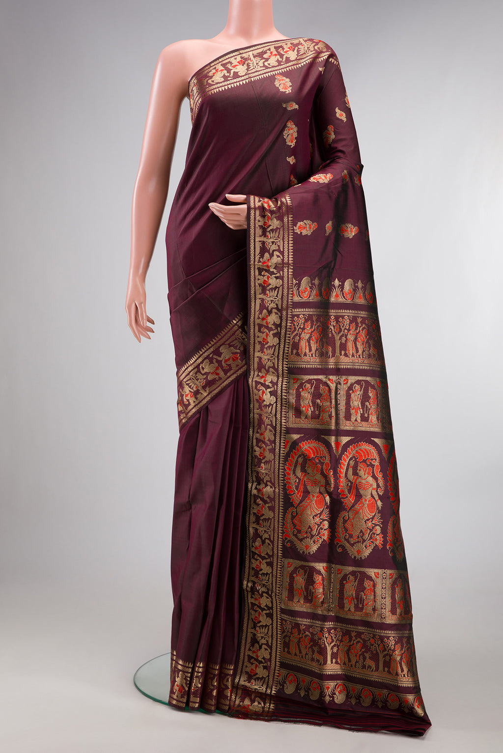 Pure Silk Coffee Brown Baluchari Saree with Zari And Thread Butta on the body and Fancy Border.  displayed on a mannequin