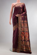 Pure Silk Coffee Brown Baluchari Saree with Zari And Thread Butta on the body and Fancy Border.  displayed on a mannequin