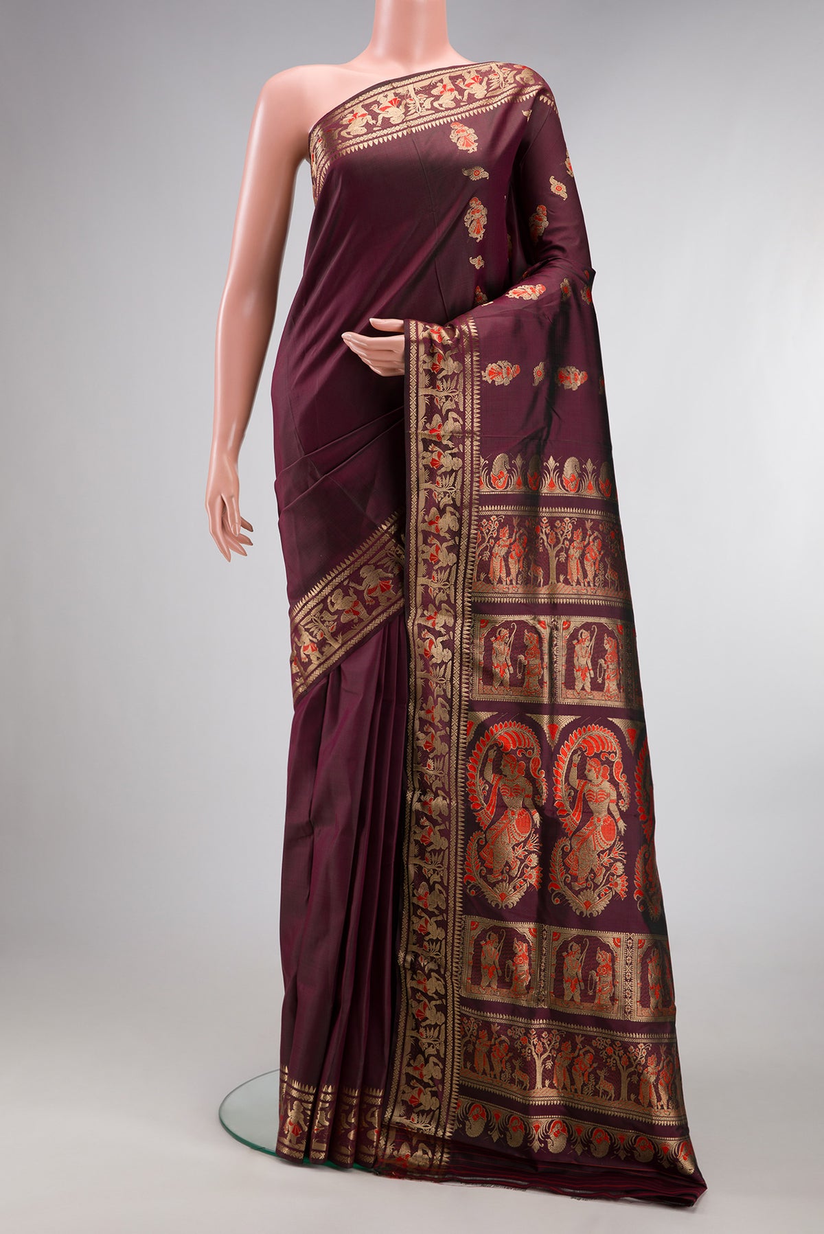 Pure Silk Coffee Brown Baluchari Saree with Zari And Thread Butta on the body and Fancy Border.  displayed on a mannequin