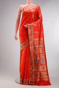 Pure Silk Orange Baluchari Saree with Zari And Thread Butta on the body and Fancy Border.  displayed on a mannequin