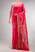 Pure Silk Coral Baluchari Saree with Zari And Thread Butta on the body and Fancy Border.  displayed on a mannequin
