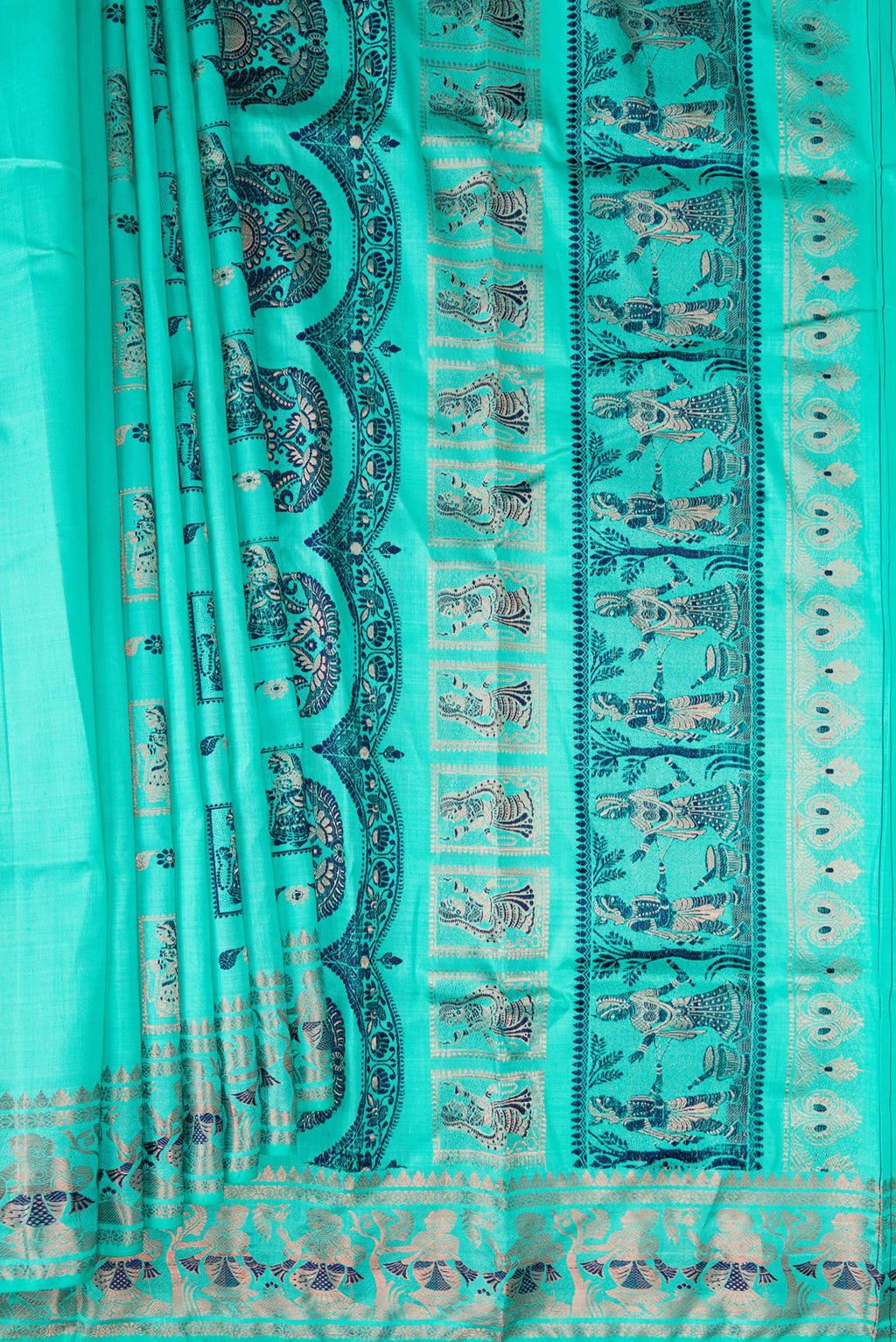 Pleats and pallu of Pure Silk Turquoise Baluchari Saree with Zari And Thread Butta on the body and Fancy Border. 