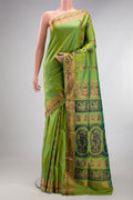 Pure Silk Parrot Green Dual Tone Baluchari Saree with Zari And Thread Butta on the body and Fancy Border.  displayed on a mannequin