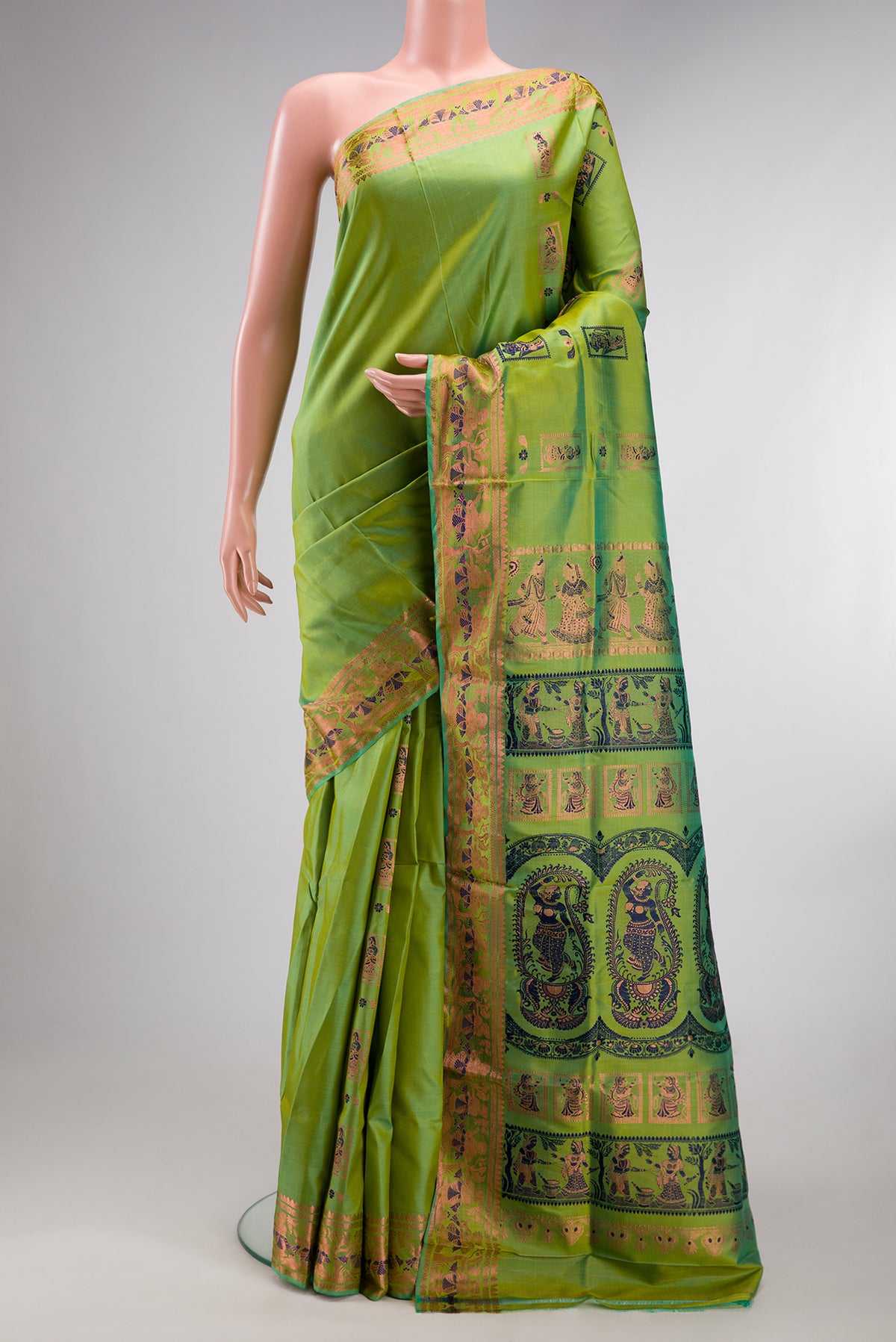 Pure Silk Parrot Green Dual Tone Baluchari Saree with Zari And Thread Butta on the body and Fancy Border.  displayed on a mannequin