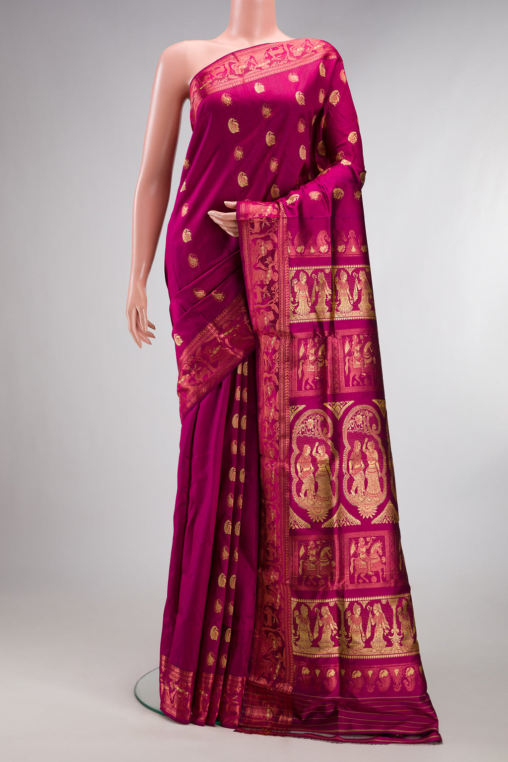 Pure Silk Magenta Dual Tone Baluchari Saree with Zari And Thread Butta on the body and Fancy Border.  displayed on a mannequin