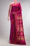 Pure Silk Magenta Dual Tone Baluchari Saree with Zari And Thread Butta on the body and Fancy Border.  displayed on a mannequin