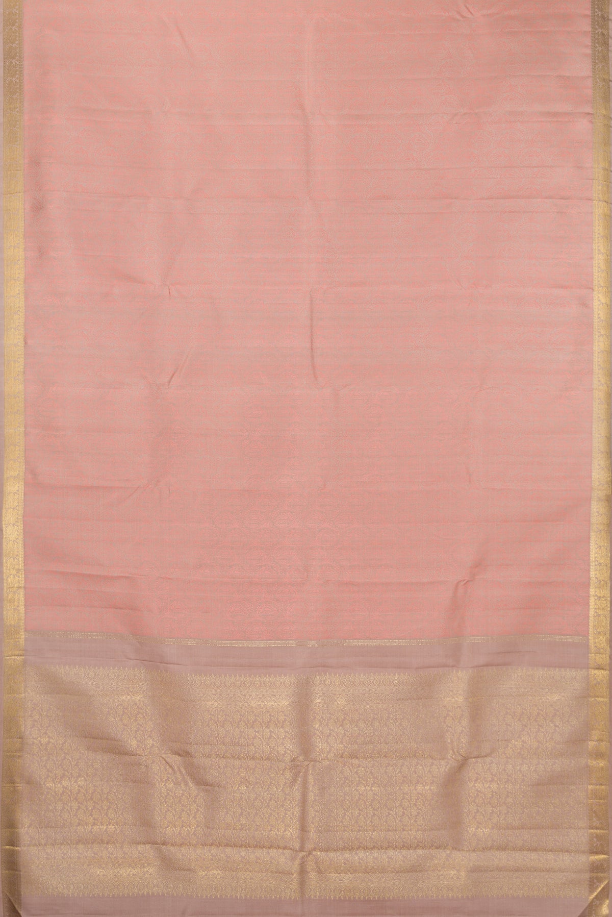 Flat view of Pure Silk Rose Gold Kanchipuram Saree with Jacquard design on the body and Zari Border. 