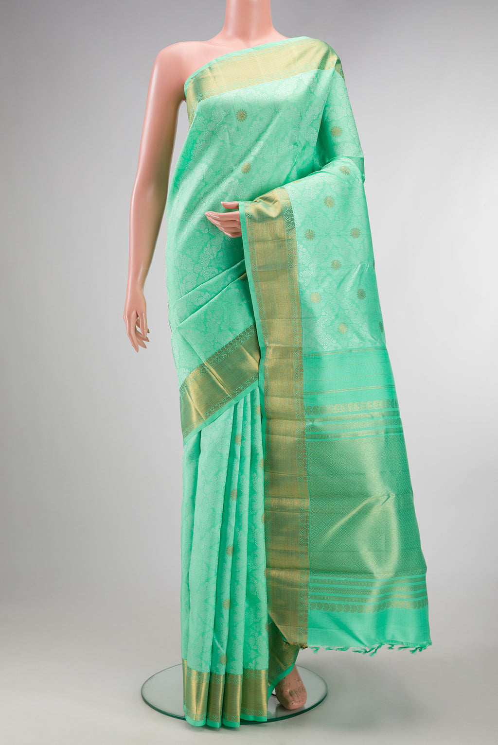 Pure Silk Pure Zari Sea Green Kanchipuram Saree with Jacquard design on the body and Zari Border.  displayed on a mannequin