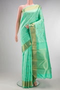 Pure Silk Pure Zari Sea Green Kanchipuram Saree with Jacquard design on the body and Zari Border.  displayed on a mannequin