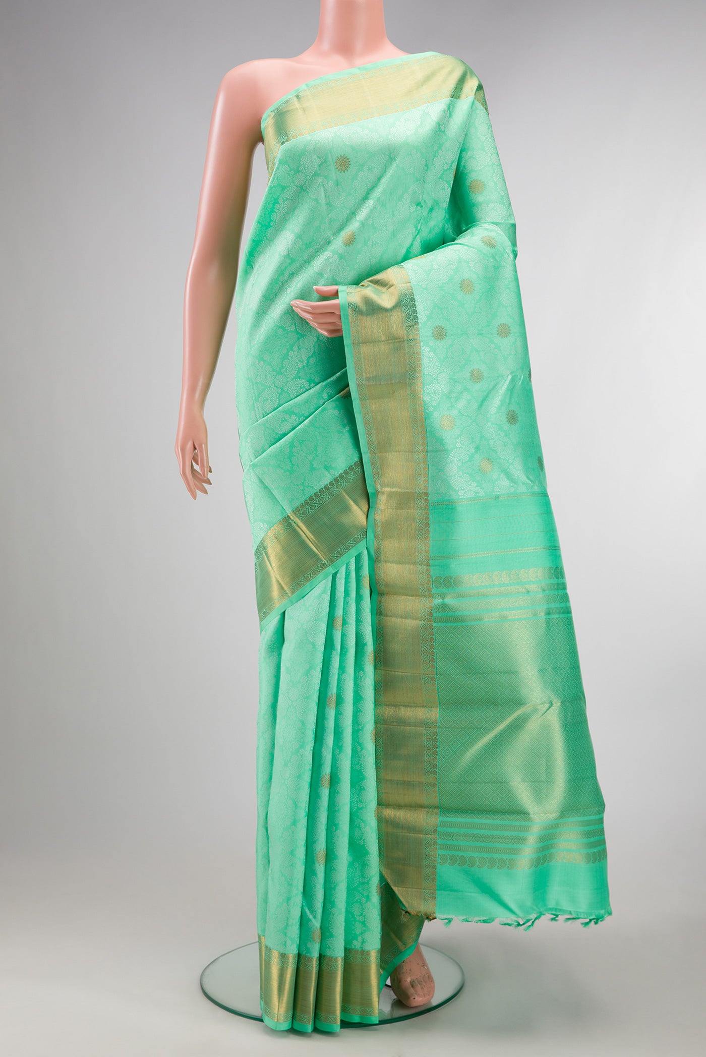 Pure Silk Pure Zari Sea Green Kanchipuram Saree with Jacquard design on the body and Zari Border.  displayed on a mannequin