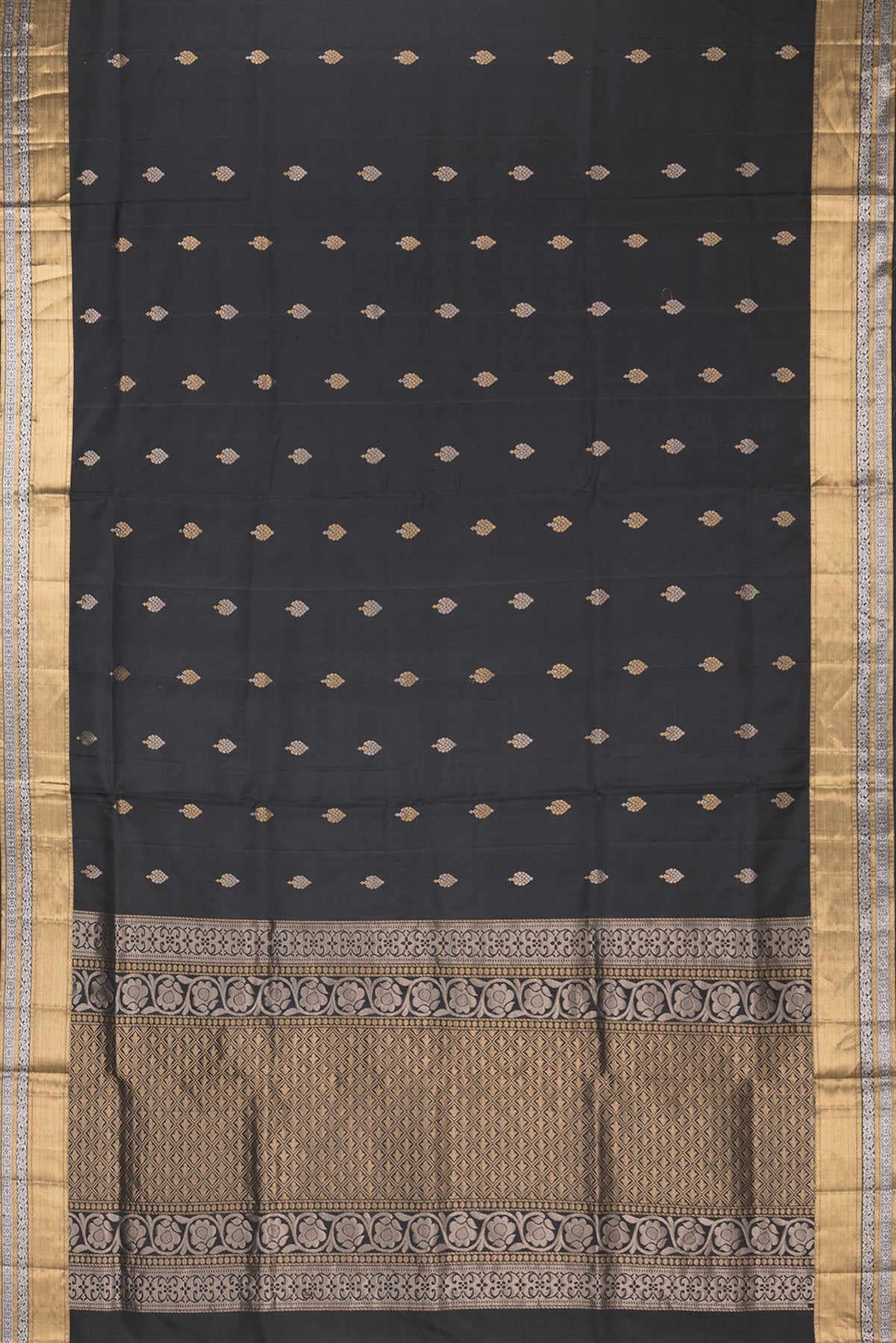 Flat view of Pure Silk Black Dual Tone Soft Saree with Zari Butta on the body and Zari Border. 