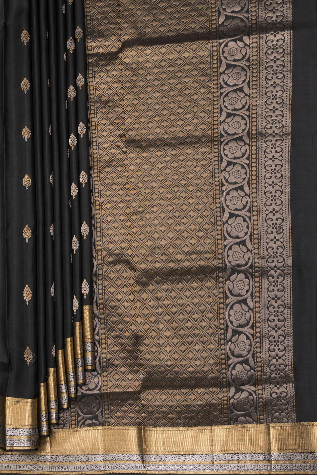 Pleats and pallu of Pure Silk Black Dual Tone Soft Saree with Zari Butta on the body and Zari Border. 