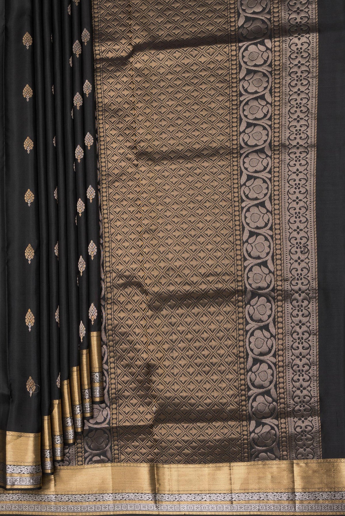 Pleats and pallu of Pure Silk Black Dual Tone Soft Saree with Zari Butta on the body and Zari Border. 