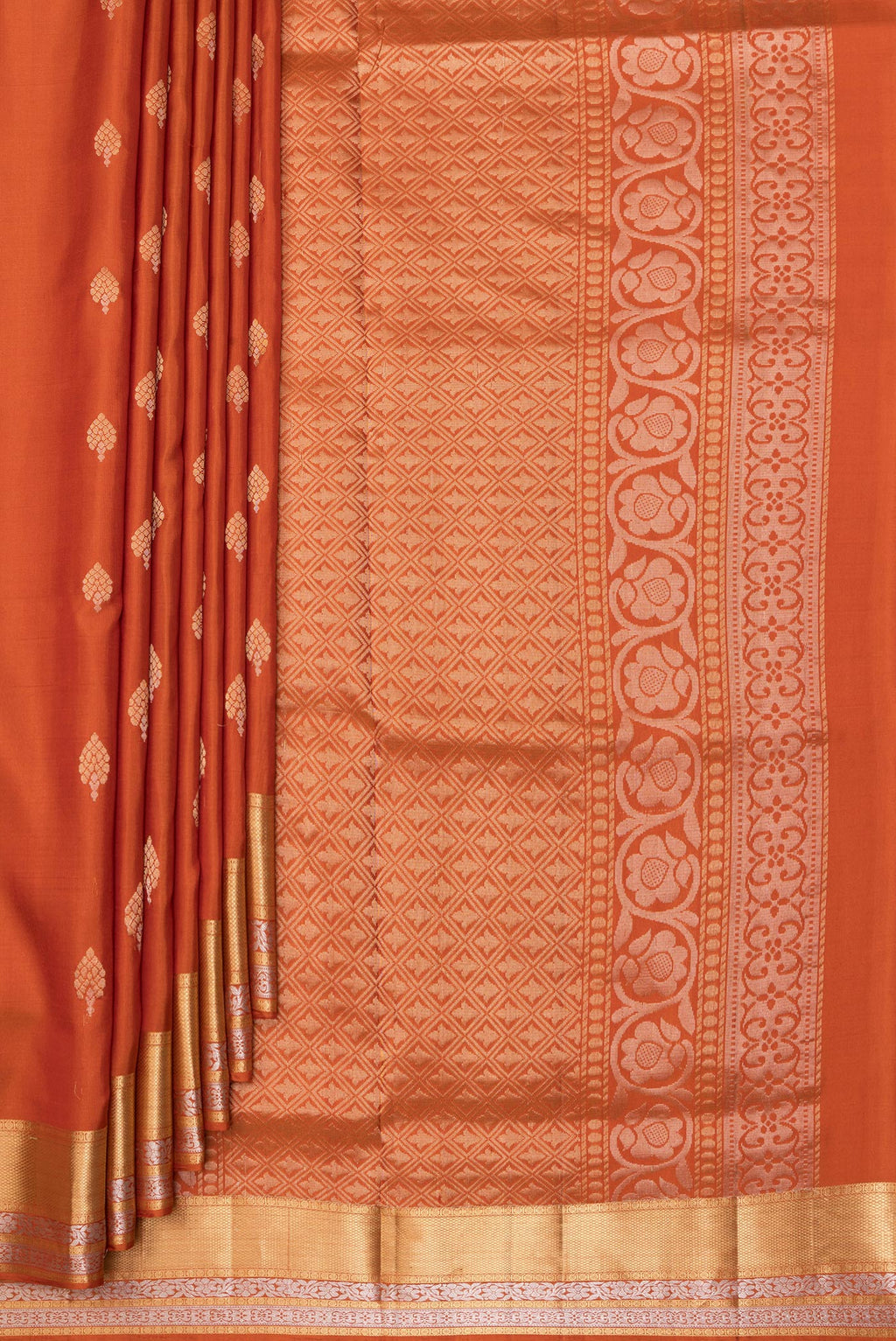 Pleats and pallu of Pure Silk Rust Dual Tone Soft Saree with Zari Butta on the body and Zari Border. 