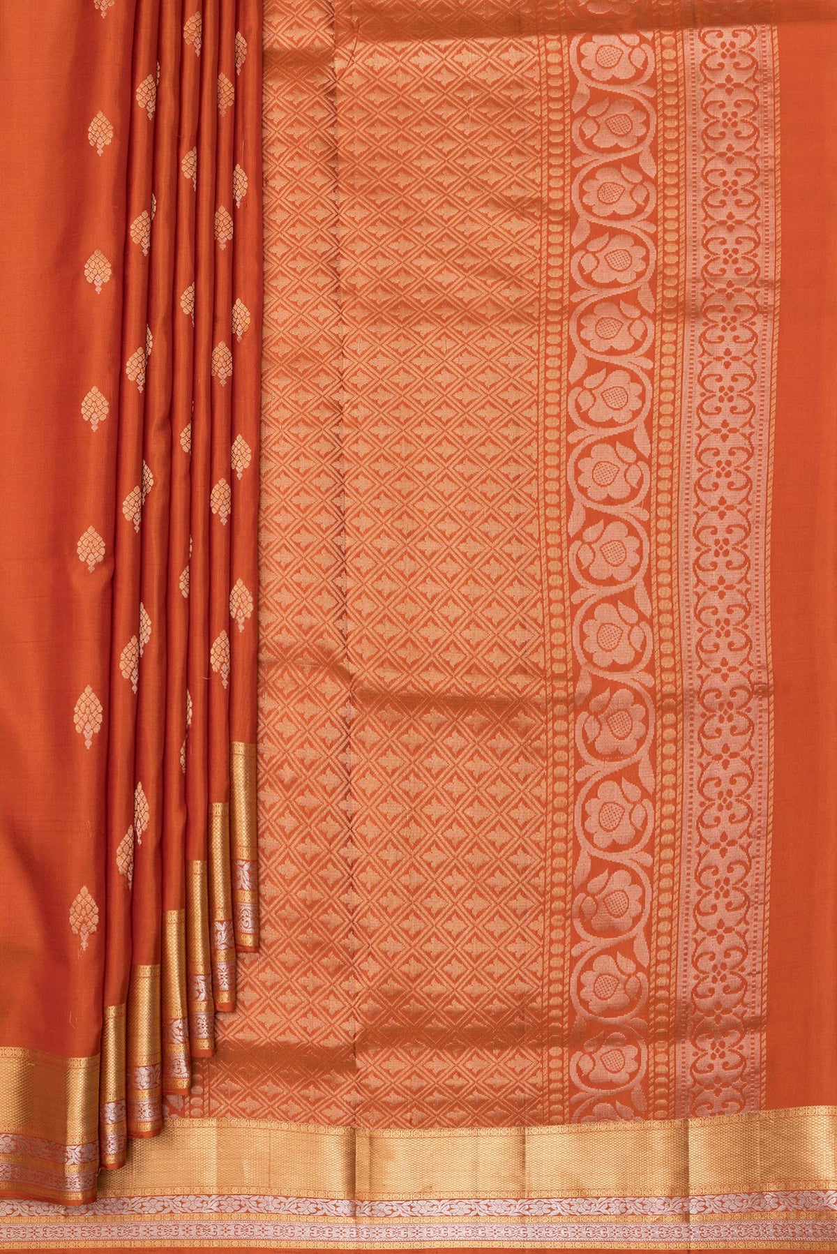 Pleats and pallu of Pure Silk Rust Dual Tone Soft Saree with Zari Butta on the body and Zari Border. 