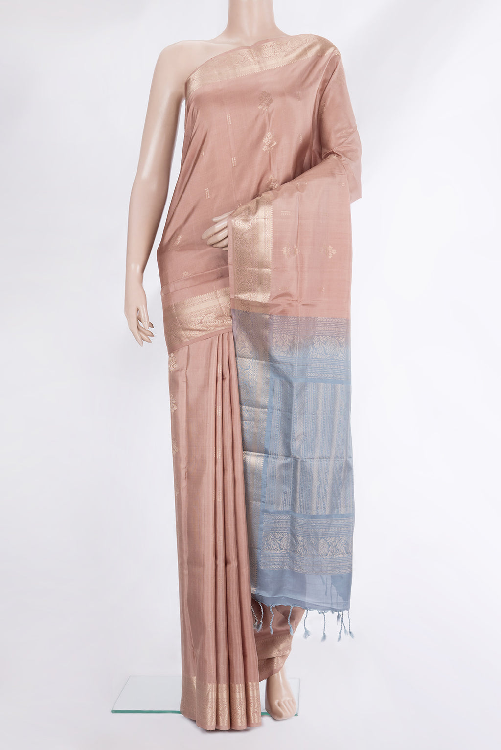 Pure Silk Rose Gold Dual Tone Soft Saree with Zari Butta on the body and Zari Border.  displayed on a mannequin