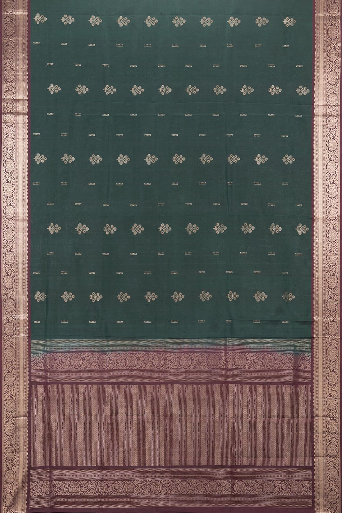 Flat view of Pure Silk Bottle Green Soft Saree with Zari Butta on the body and Zari Border. 