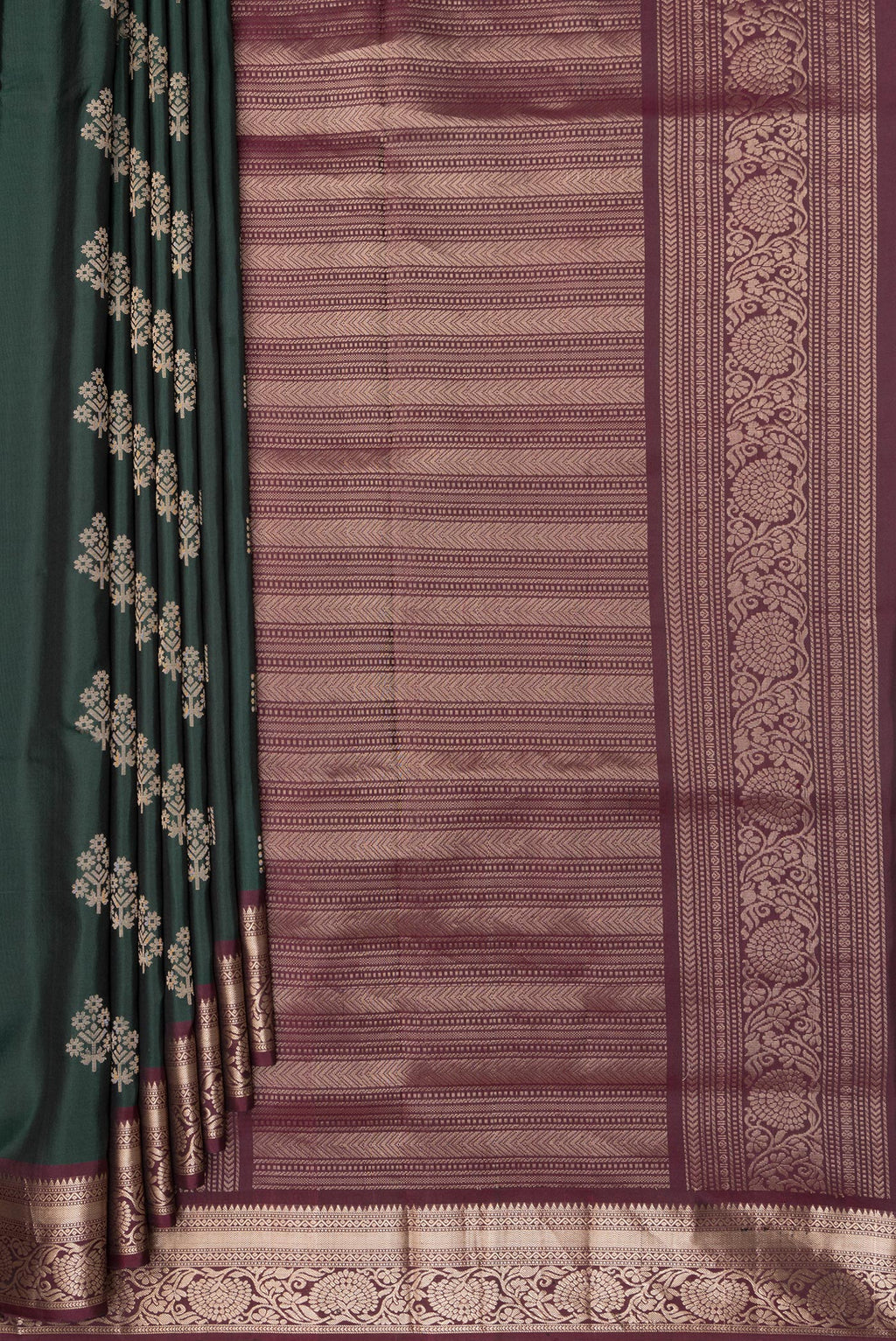 Pleats and pallu of Pure Silk Bottle Green Soft Saree with Zari Butta on the body and Zari Border. 