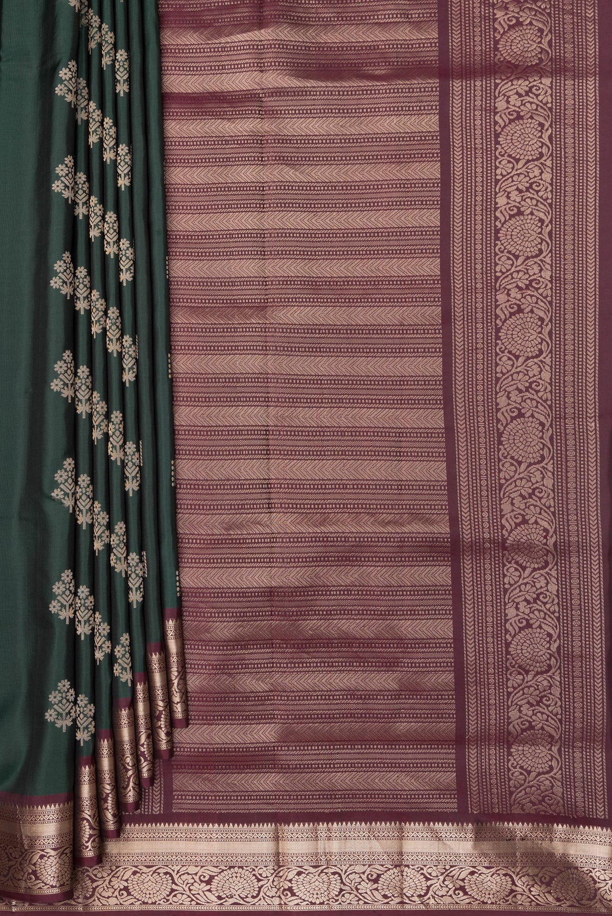 Pleats and pallu of Pure Silk Bottle Green Soft Saree with Zari Butta on the body and Zari Border. 
