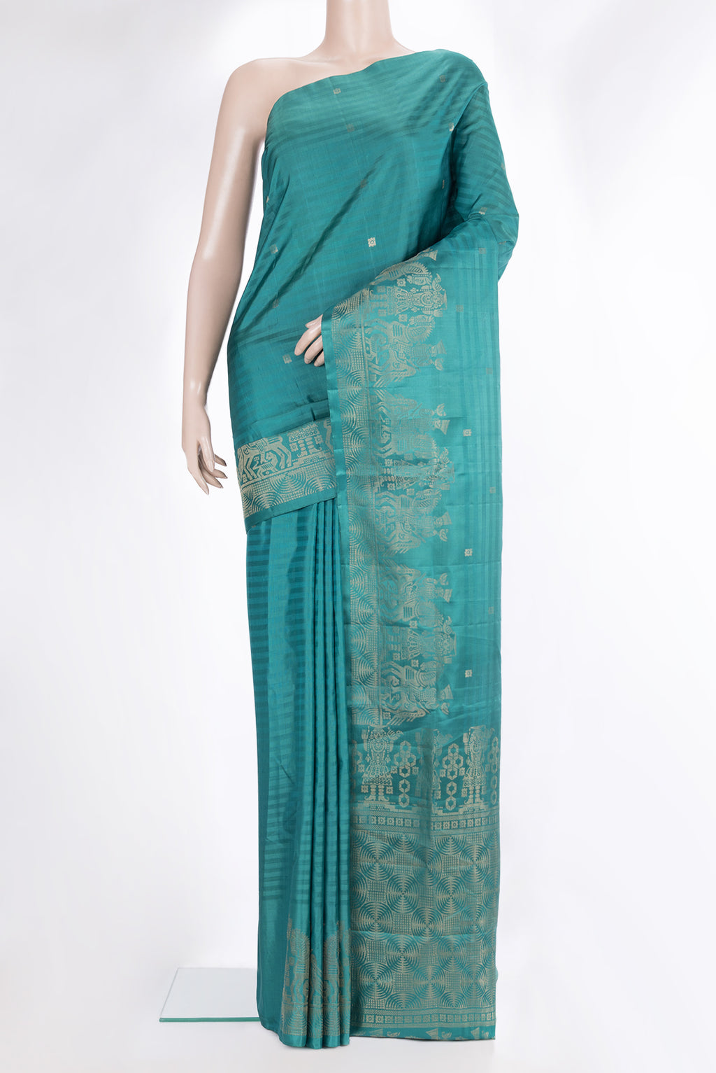 Pure Silk Peacock Blue Dual Tone Soft Saree with Zari Butta on the body and Fancy Border.  displayed on a mannequin