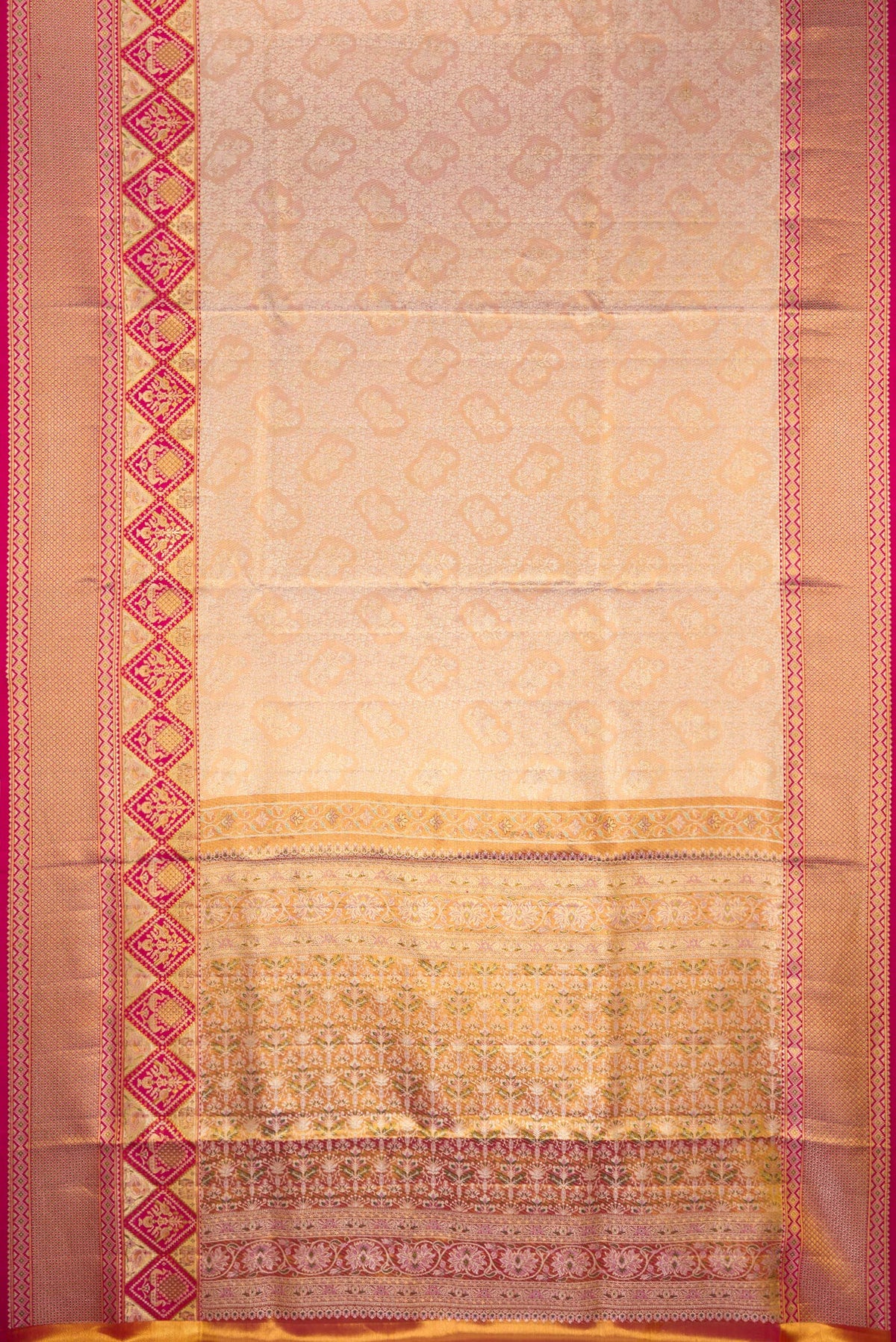 Flat view of Rose Gold Dual Tone Kanchipuram Tissue Saree with Zari Brocade on the body and Fancy Border. 