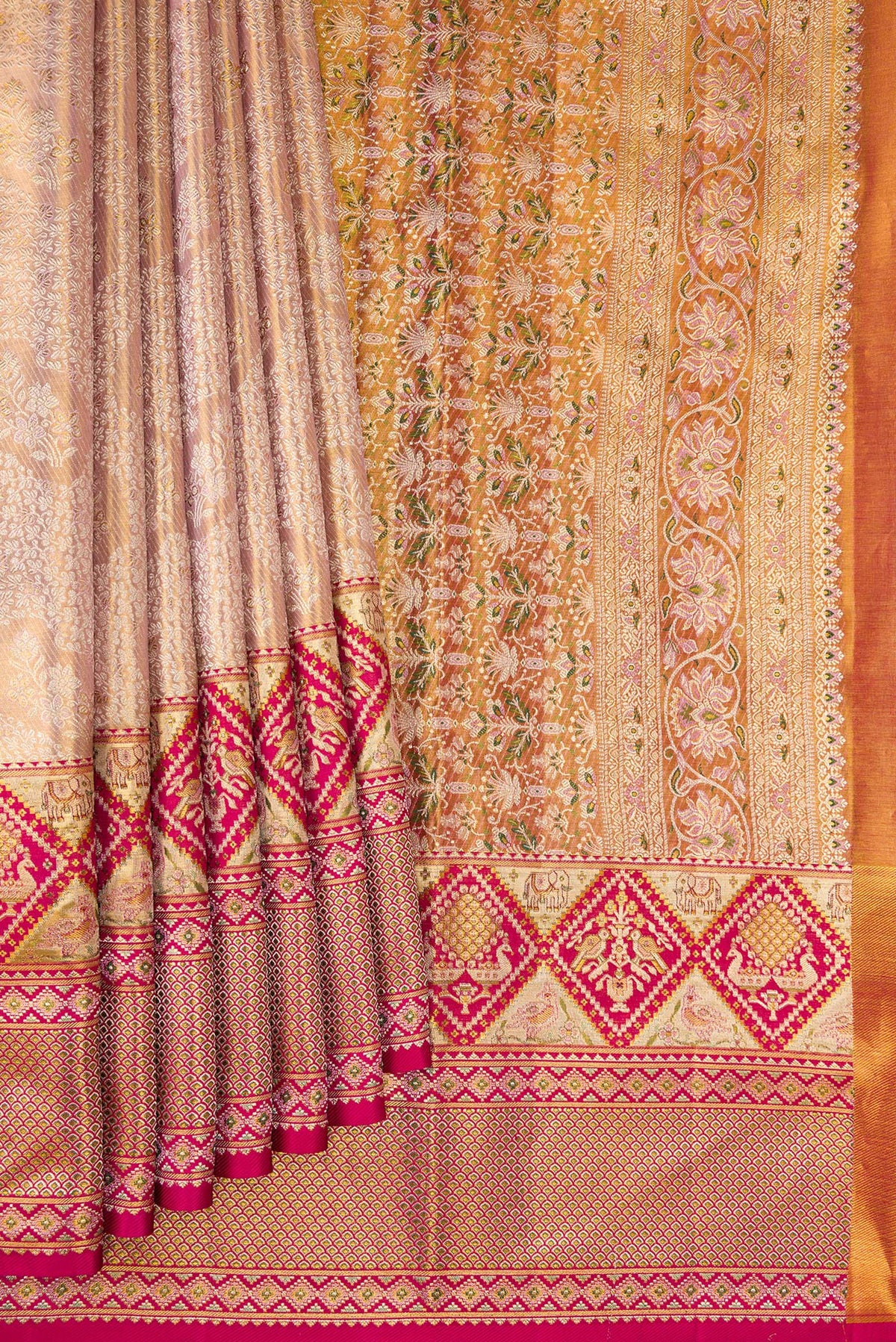 Pleats and pallu of Rose Gold Dual Tone Kanchipuram Tissue Saree with Zari Brocade on the body and Fancy Border. 