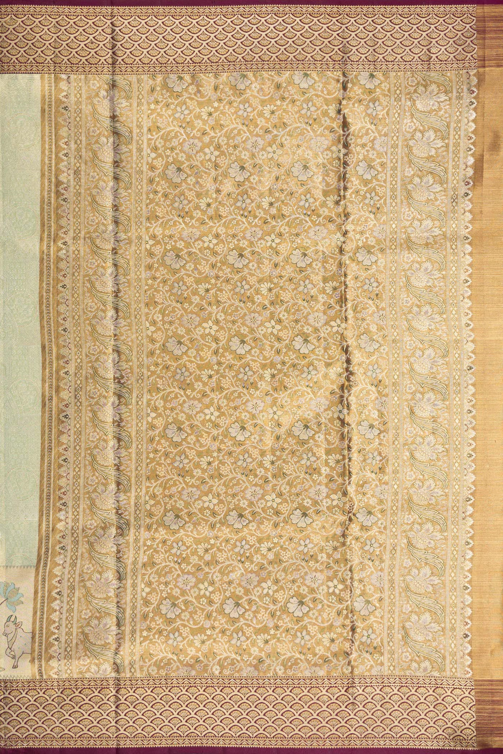 Close up image of the pallu of Pista Green Dual Tone Kanchipuram Tissue Saree with Zari Brocade on the body and Fancy Border. 