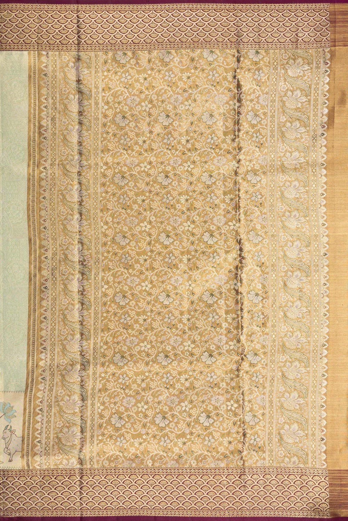 Close up image of the pallu of Pista Green Dual Tone Kanchipuram Tissue Saree with Zari Brocade on the body and Fancy Border. 