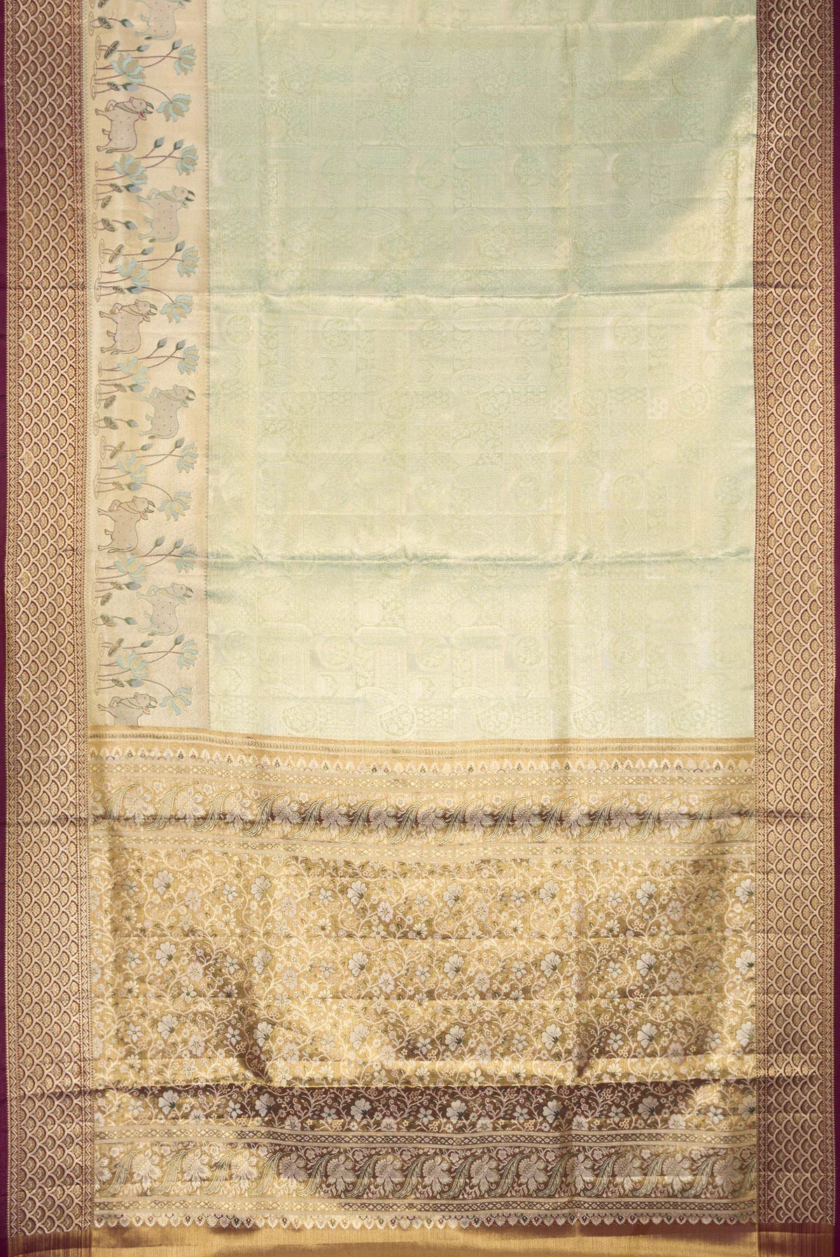 Flat view of Pista Green Dual Tone Kanchipuram Tissue Saree with Zari Brocade on the body and Fancy Border. 