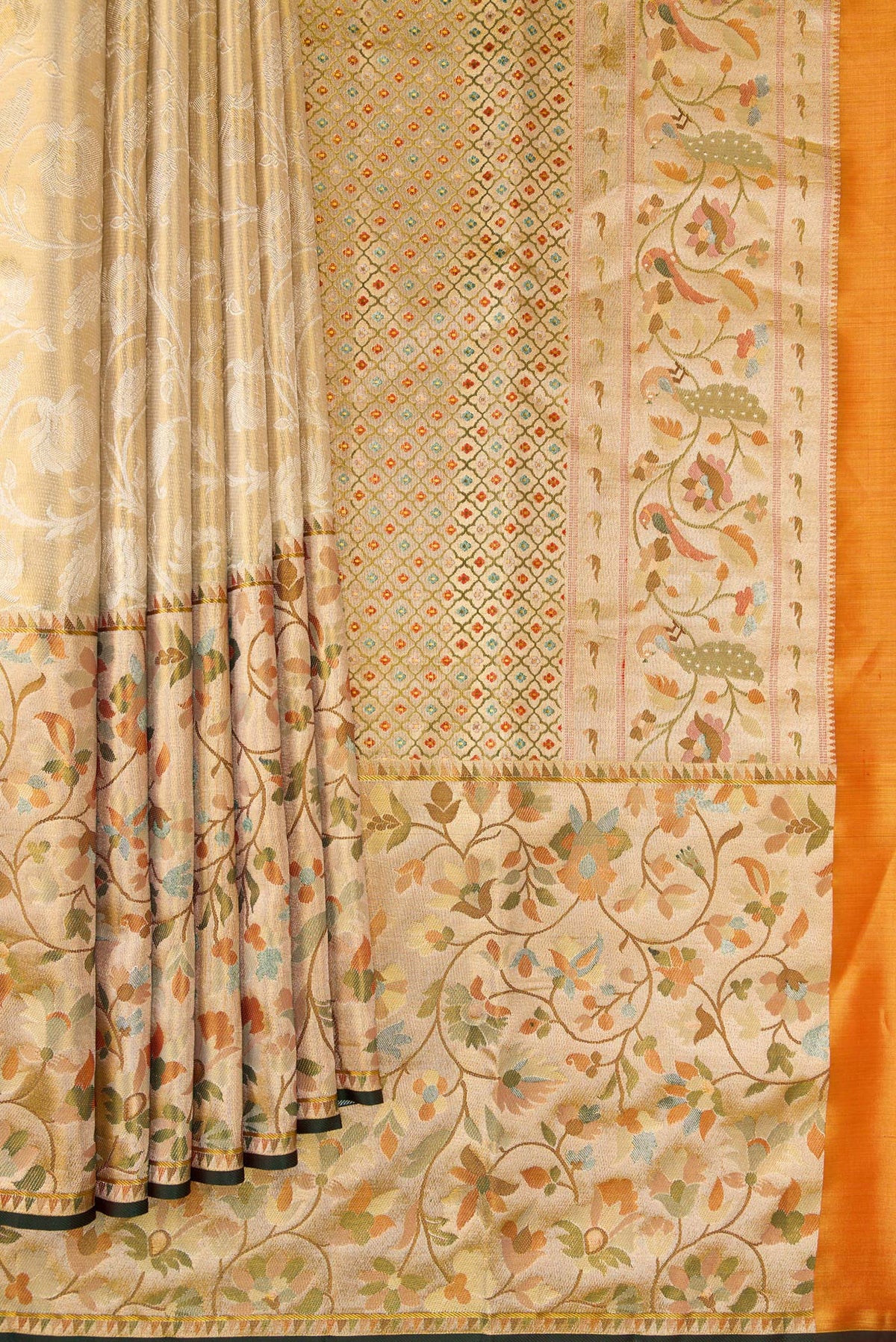 Pleats and pallu of Gold Dual Tone Kanchipuram Tissue Saree with Zari Brocade on the body and Fancy Border. 