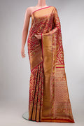 Deep Red Dual Tone Kanchipuram Tissue Saree with Zari Brocade on the body and Fancy Border.  displayed on a mannequin